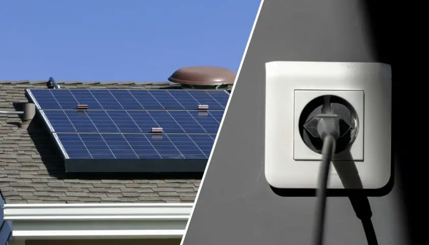 Solarpanels auf einem Dach und ein Stecker in einer Steckdose. Das Balkonkraftwerk speist nicht ein.